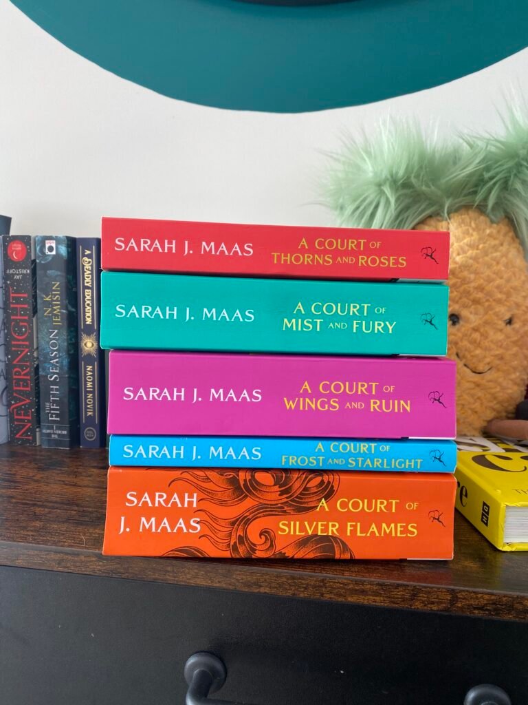 All ACOTAR books stacked on top of each other